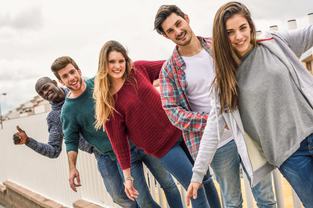 Group of friends having fun together outdoors